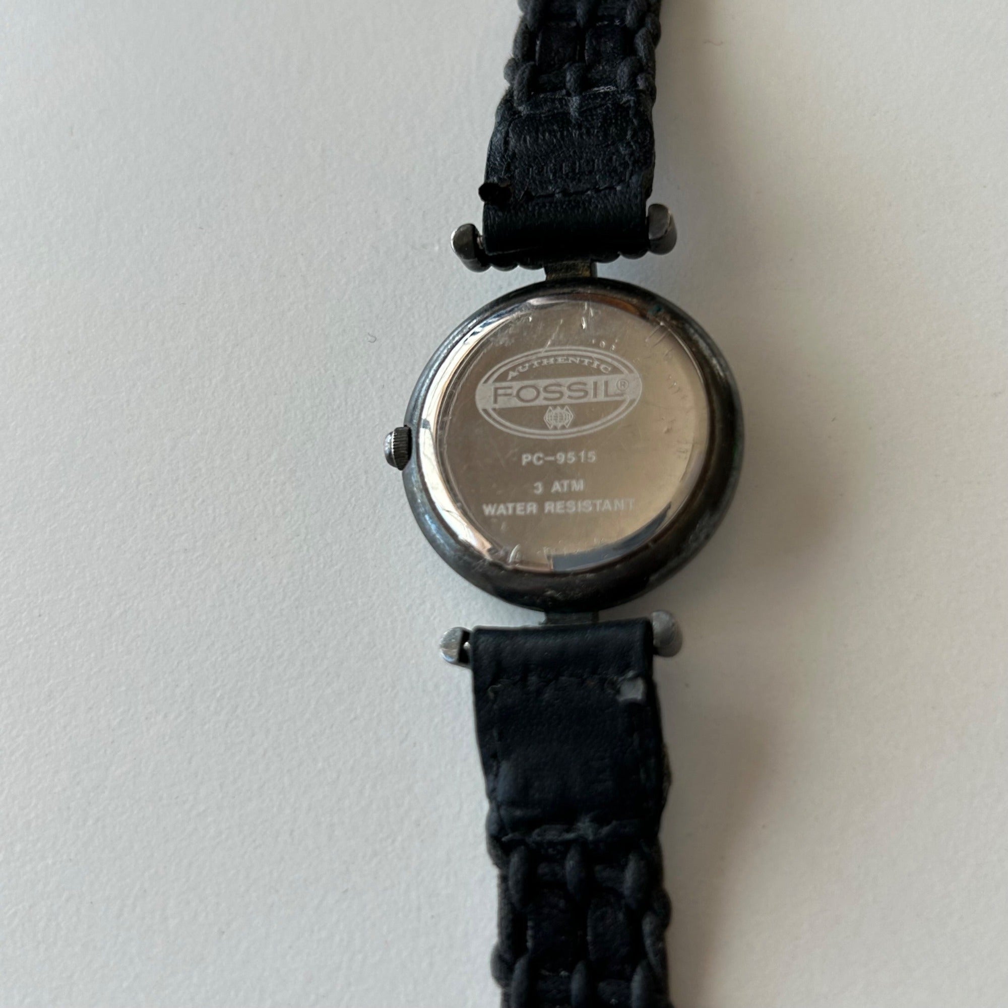 Fossil Womens PC-9155 Silver-Tone Analog Watch With Black Braided Leather Strap