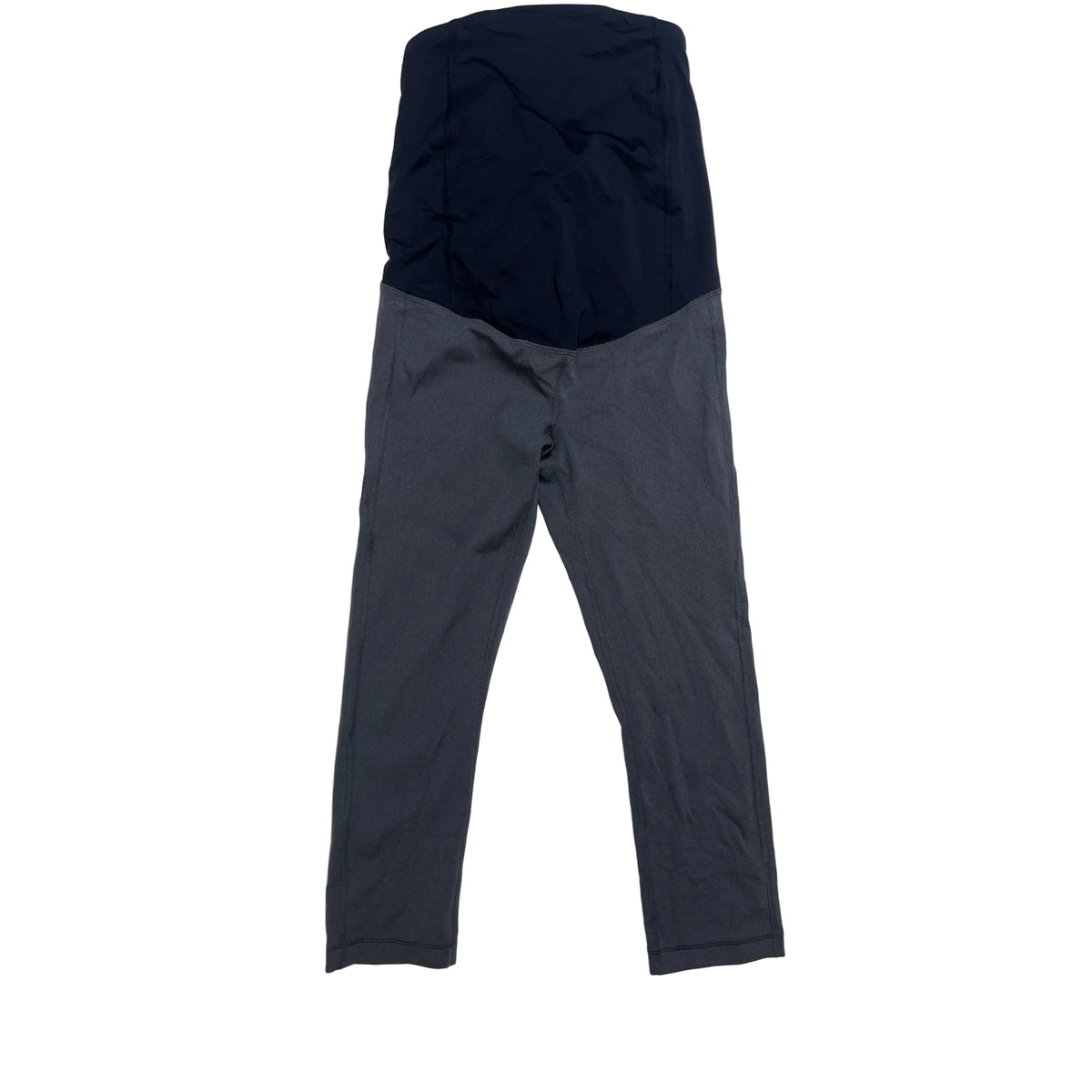 A pair of maternity leggings laid flat on a light beige fabric background. The top section is a solid dark navy blue, and the bottom section is dark gray.